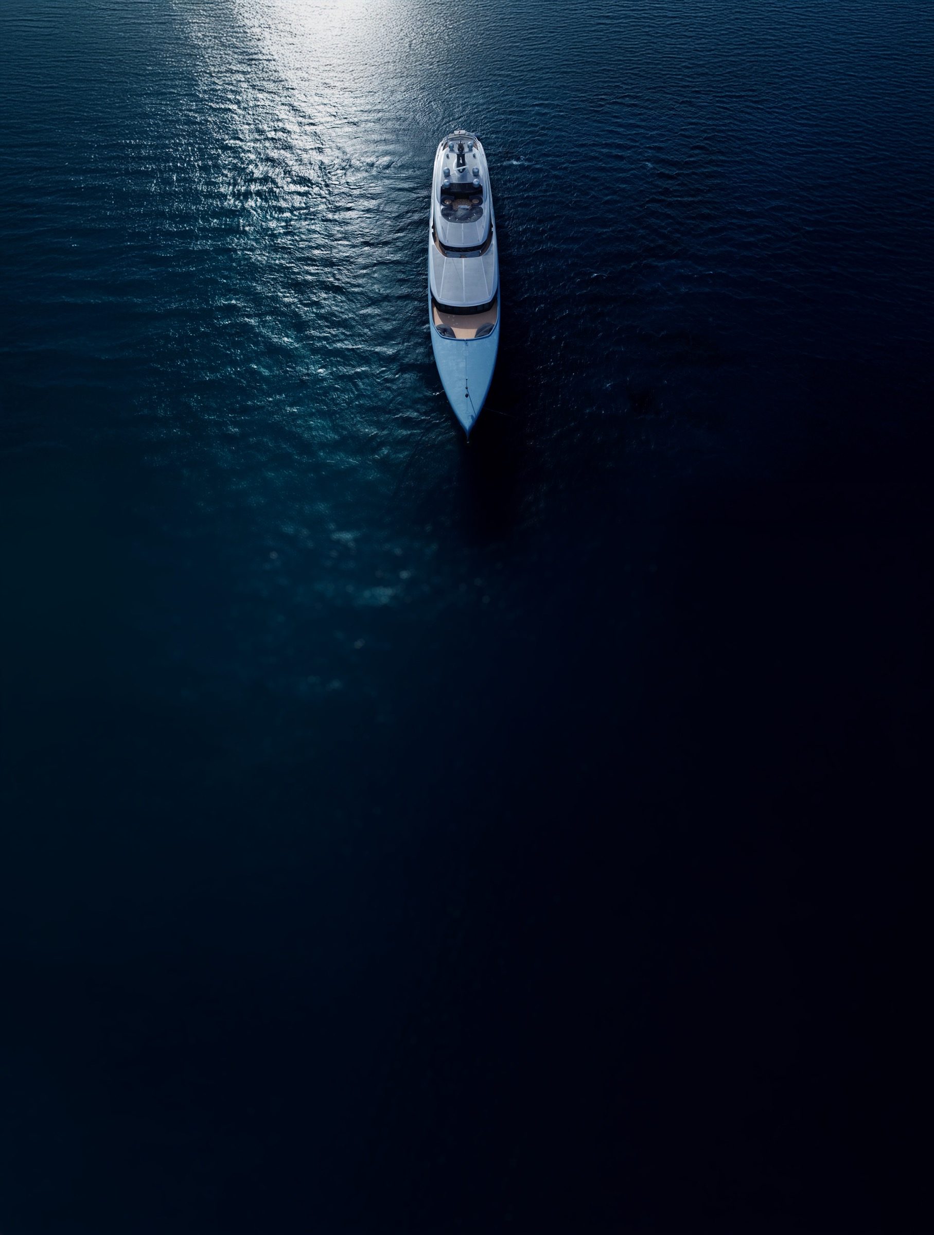 Aerial view of the Bualume yacht crossing deep blue water