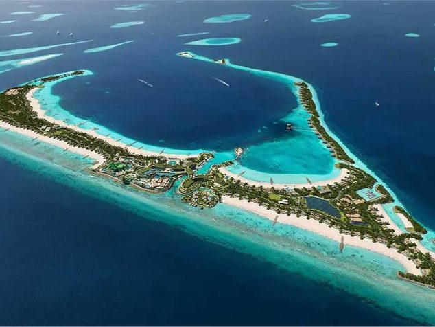 Aerial view of turquoise atolls and deep blue ocean