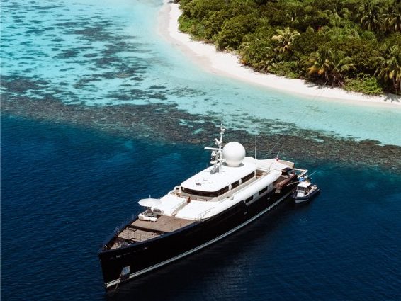 Bualume yacht anchored beside a bright tropical island