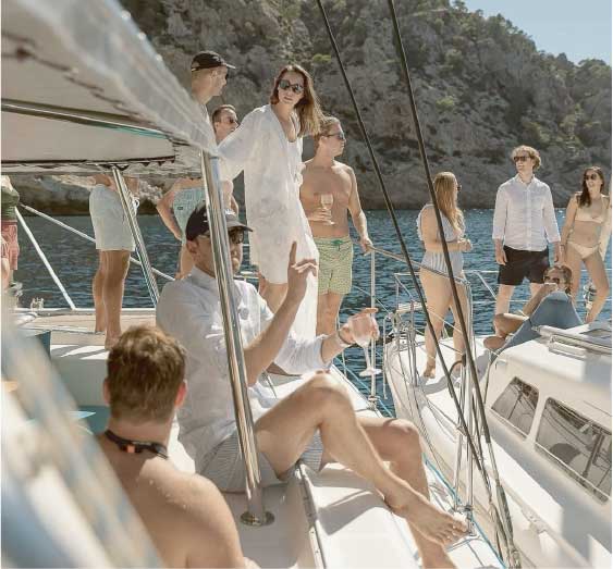 Guests relaxing together on a yacht deck